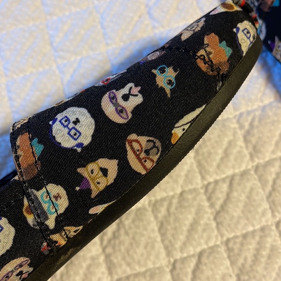 BOBS By Skechers slip on shoes in black with various dog designs on the shoes. - Picture 7 of 8